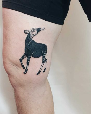 Okapi tattoo on the thigh