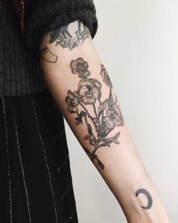 Pansies tattoo on the forearm