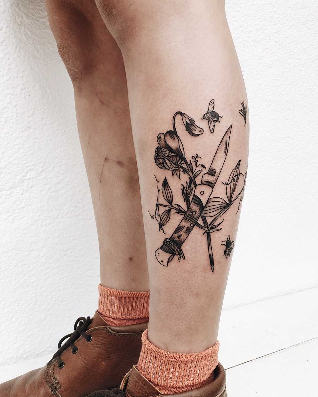 Pocketknife and flowers tattoo