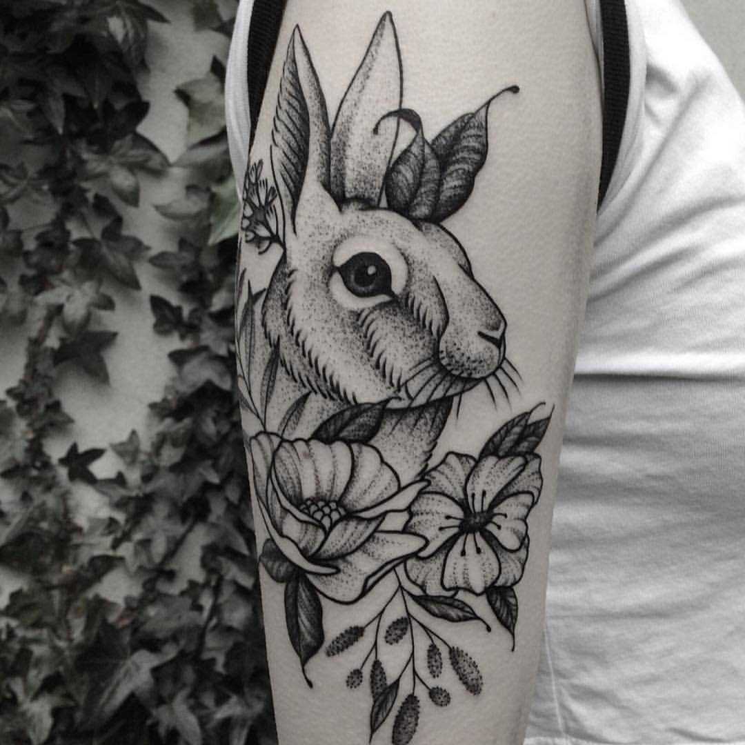 Rabbit and flowers tattoo by Roald Vd Broek