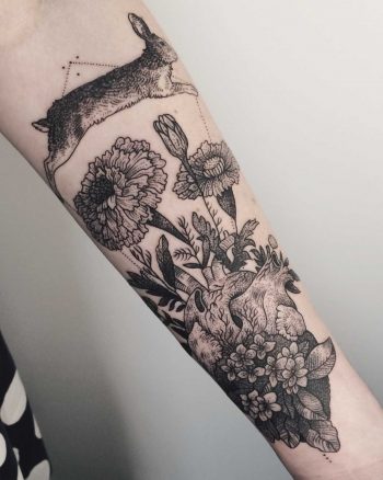 Rabbit jumping over a heart tattoo by Pony Reinhardt