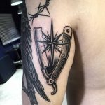 Razor and compass rose tattoo