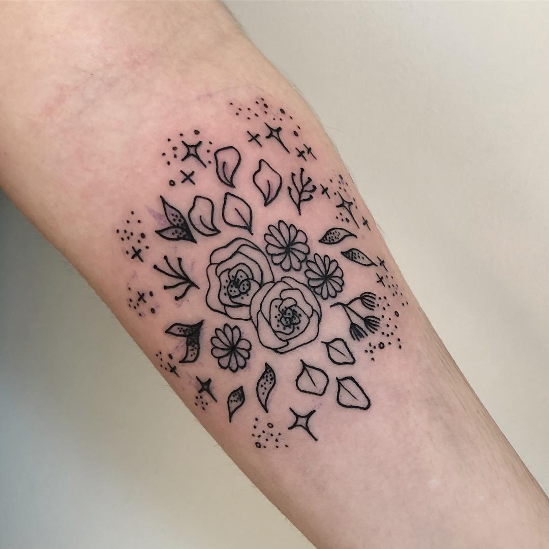 Scattered leaves and flowers tattoo