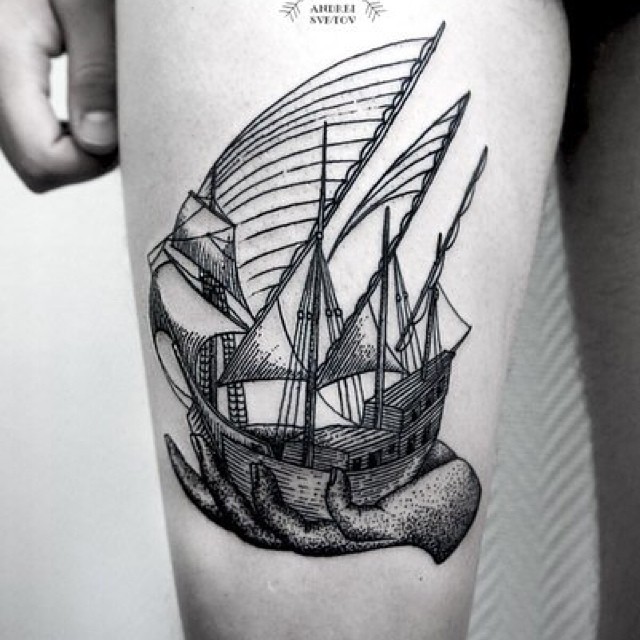Ship in a hand tattoo