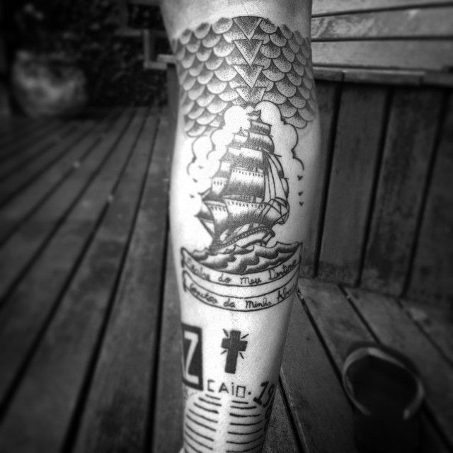 Ship tattoo on the right calf