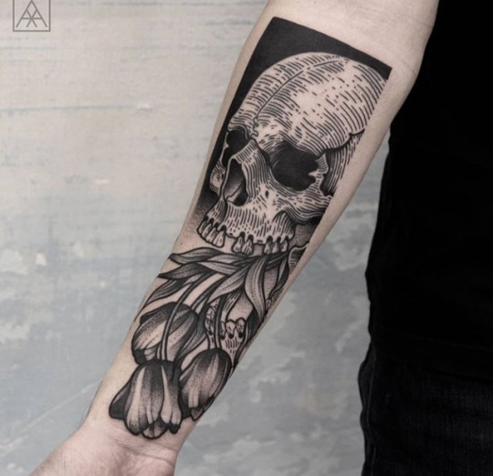 Skull with tulips tattoo