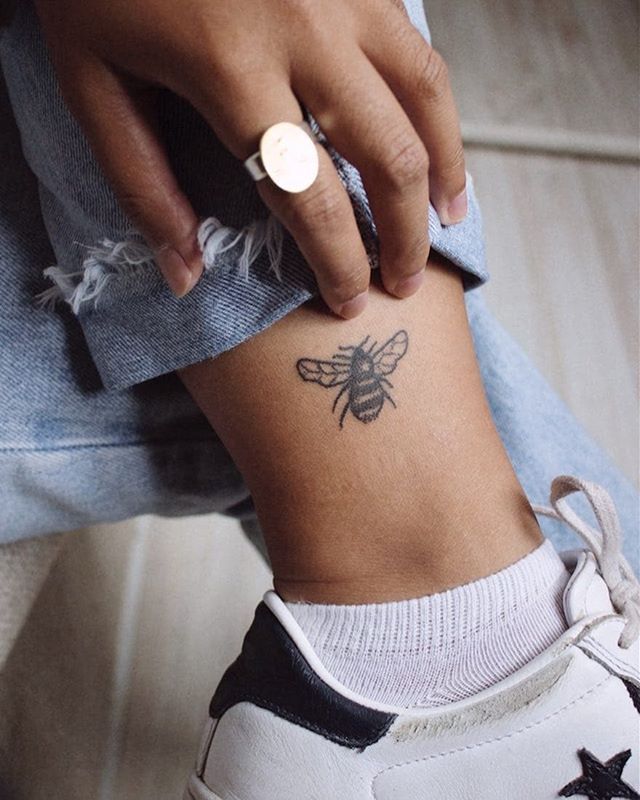 Small bee tattoo on the left ankle