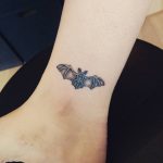 Small hand-poked bat tattoo