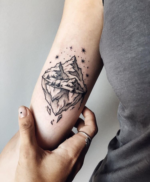 Small mountain tattoo by Sasha Kiseleva