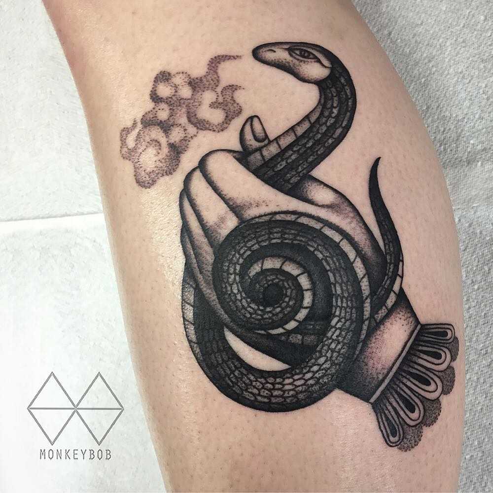 Snake handler’s tattoo
