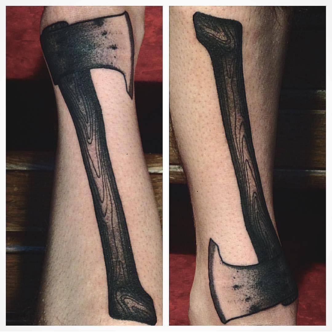 Solid blackwork ax tattoo