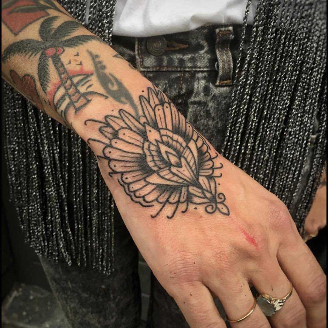 Stylized flower tattoo by Bastien Jean