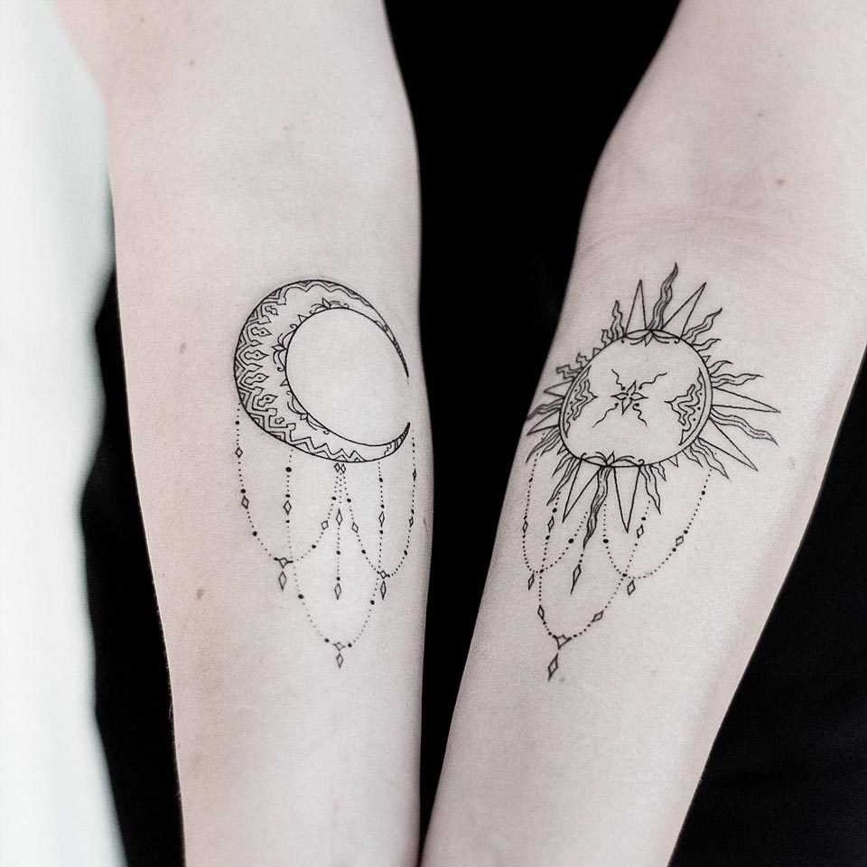 Stylized moon and sun tattoos by Dogma Noir