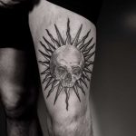 Sun and skull tattoo