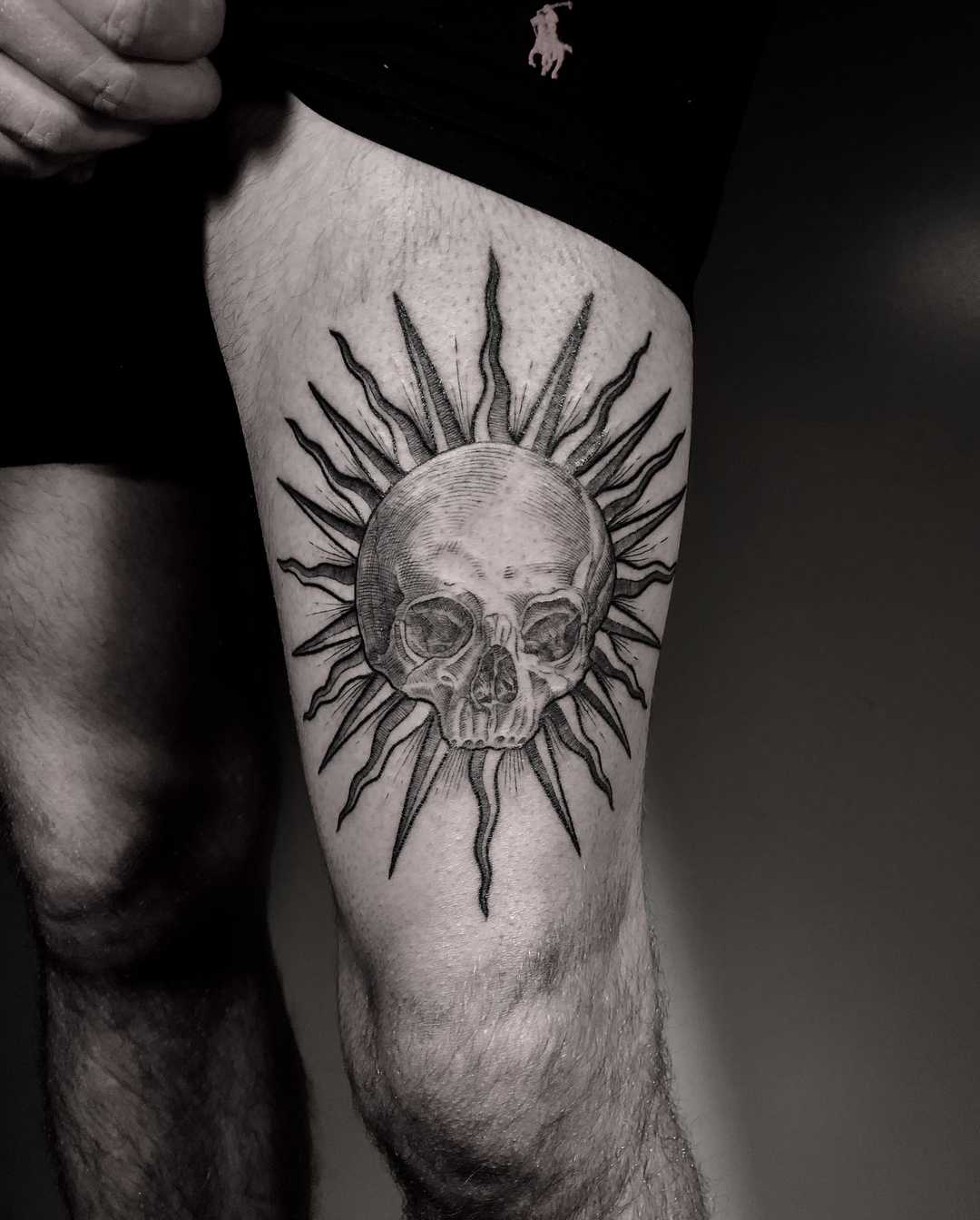 Sun and skull tattoo