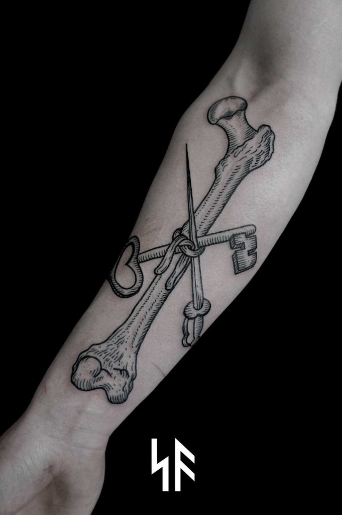 Sword, bone, and key tattoo