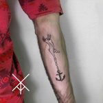 Tattoo of a rabbit chained to an anchor