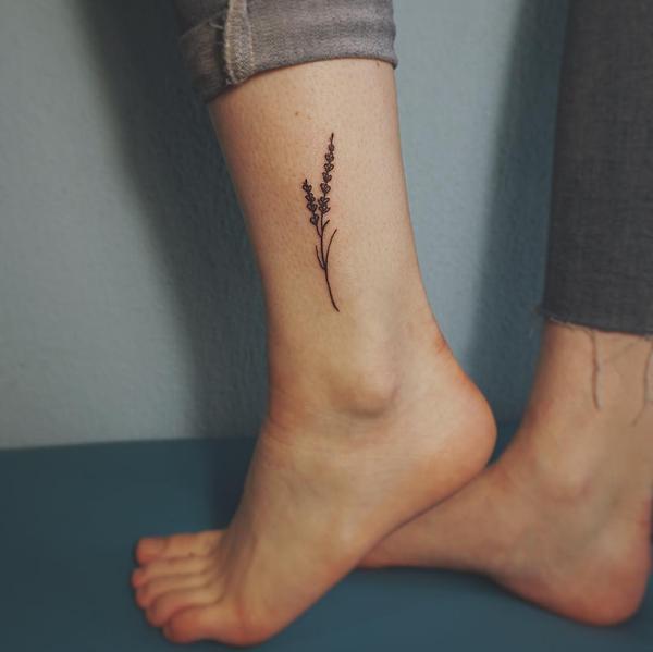 Tiny lavander tattoo on the left ankle