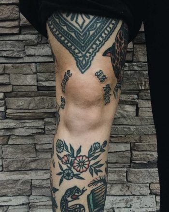 Traditional tattoos on the shin and thigh