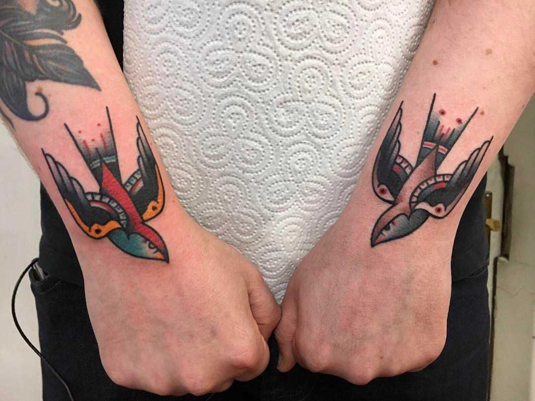 Two swallow tattoos by Jeroen Van Dijk