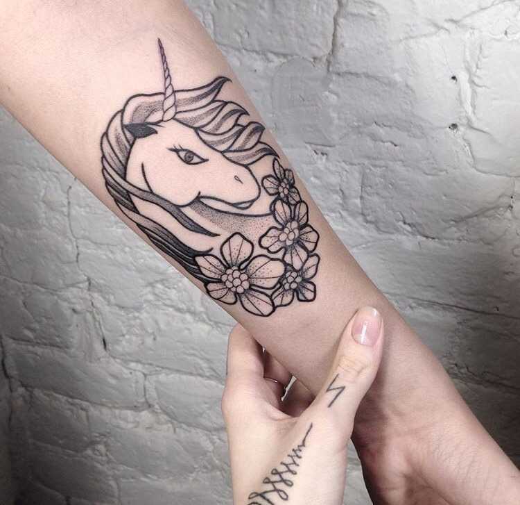 Unicorn tattoo by Slavena Vena