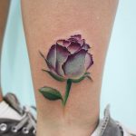 Violet rose tattoo on the ankle