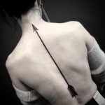 Arrow tattoo on the back by Unkle Gregory