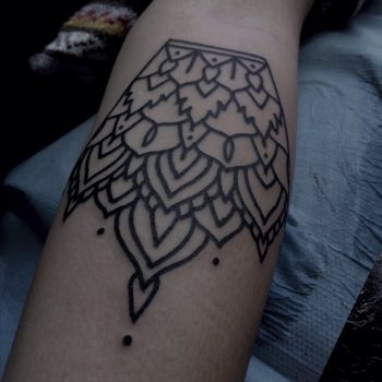 Black outline ornament tattoo