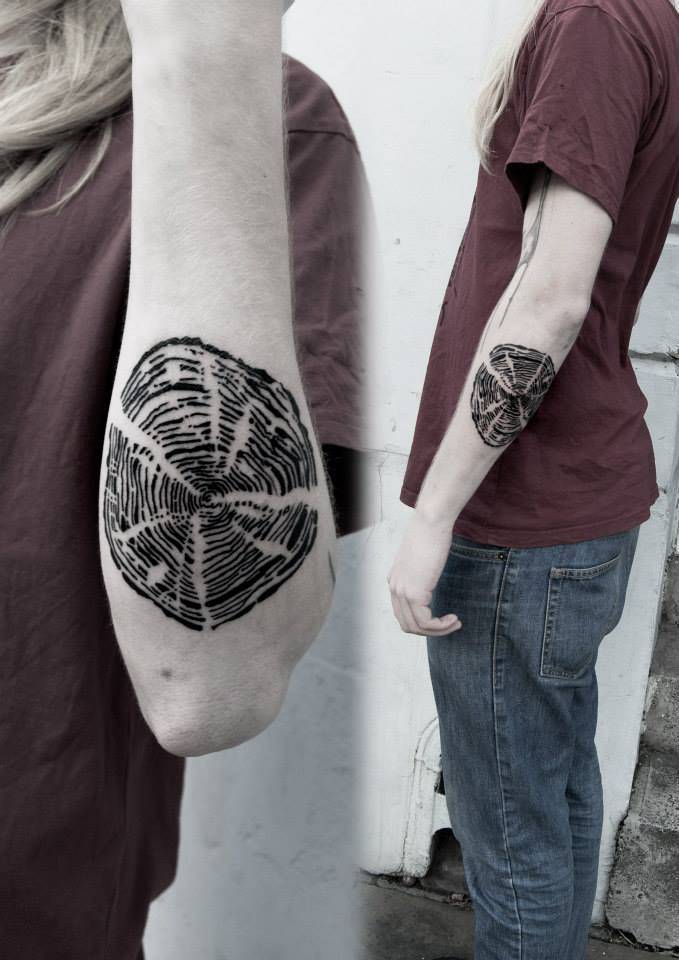 Black tree ring tattoo