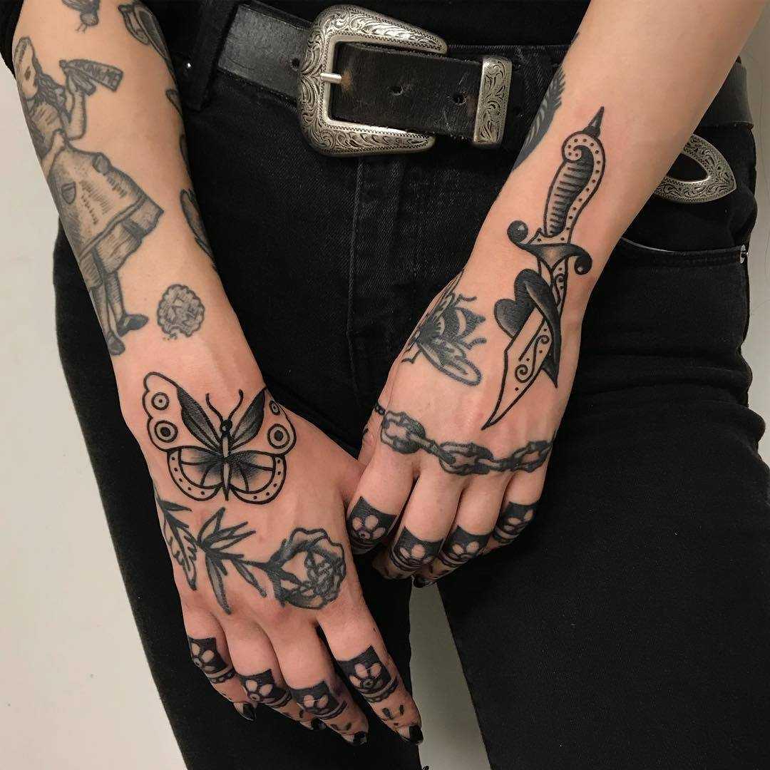 Chain, rose and butterfly tattoos