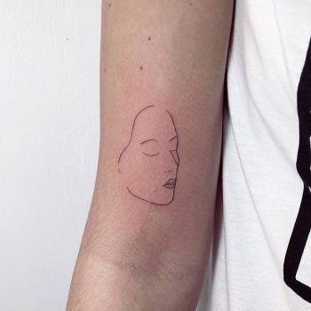 Face tattoo by Devol Tattooer