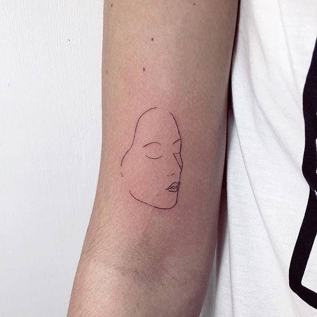 Face tattoo by Devol Tattooer