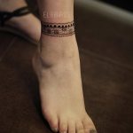 Floral anklet tattoo by Elda Bernardes