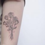 Floral bouquet tattoo by Lindsay April