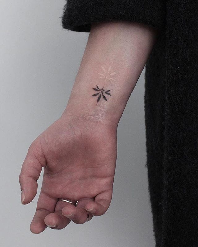 Hand-poked black and white Lotus tattoo 