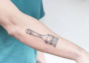 Hand-poked brush tattoo