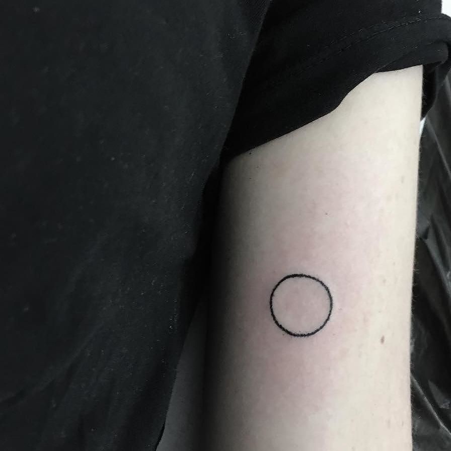 Hand-poked circle by Zero Zero Tattoos