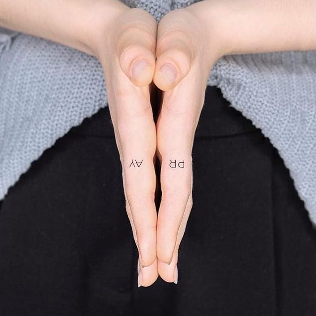 Hand-poked pray tattoo