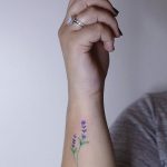 Hand-poked violet flower tattoo