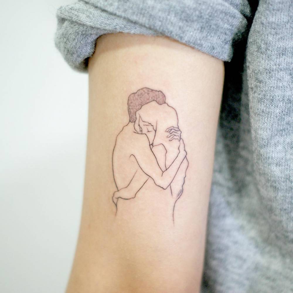 Hug tattoo on the arm