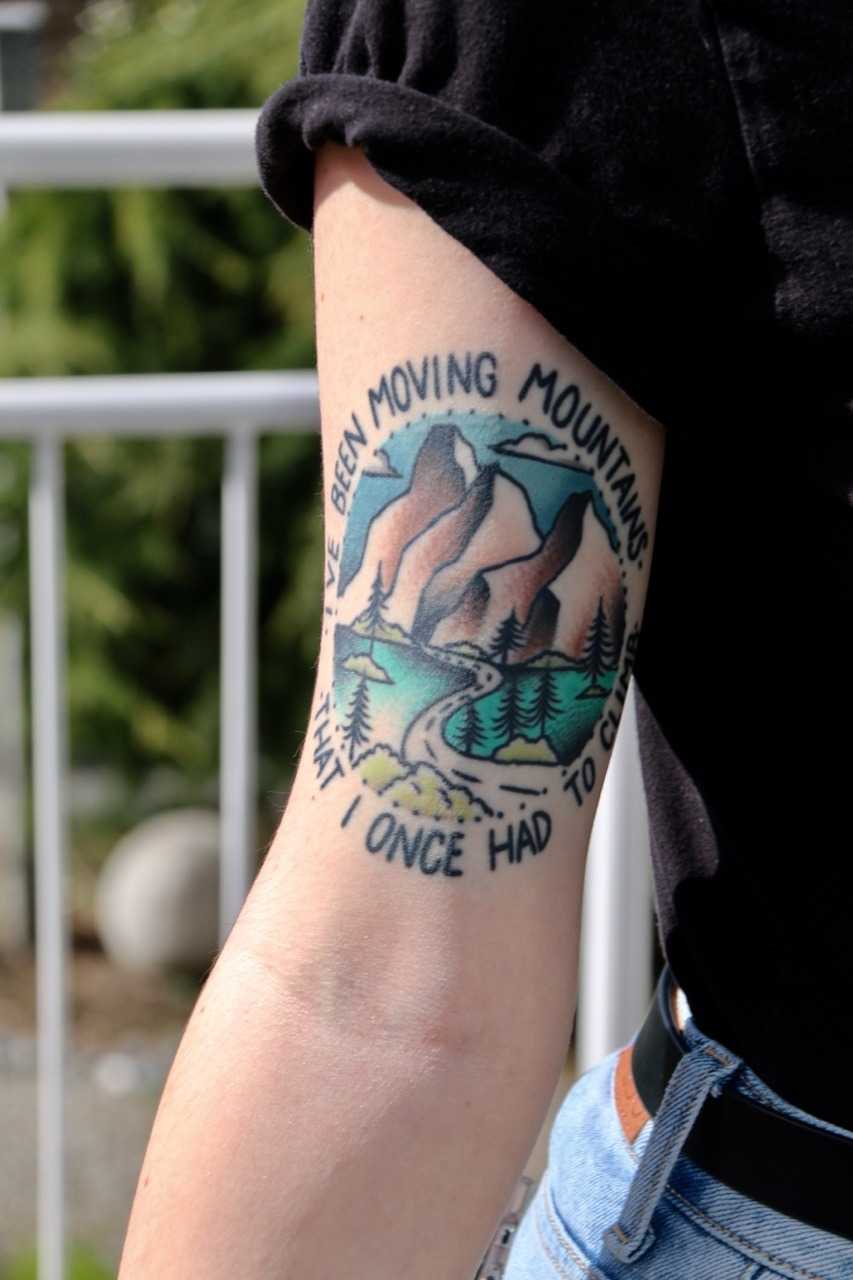 Landscape and quote tattoo