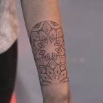 Mandala wrist tattoo by Lindsay April
