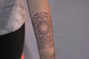 Mandala wrist tattoo by Lindsay April