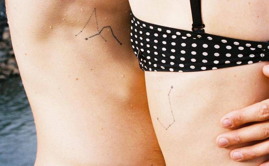 Matching constellation tattoos on ribs
