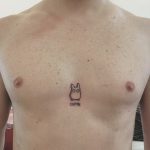 Mini Totoro tattoo on the chest