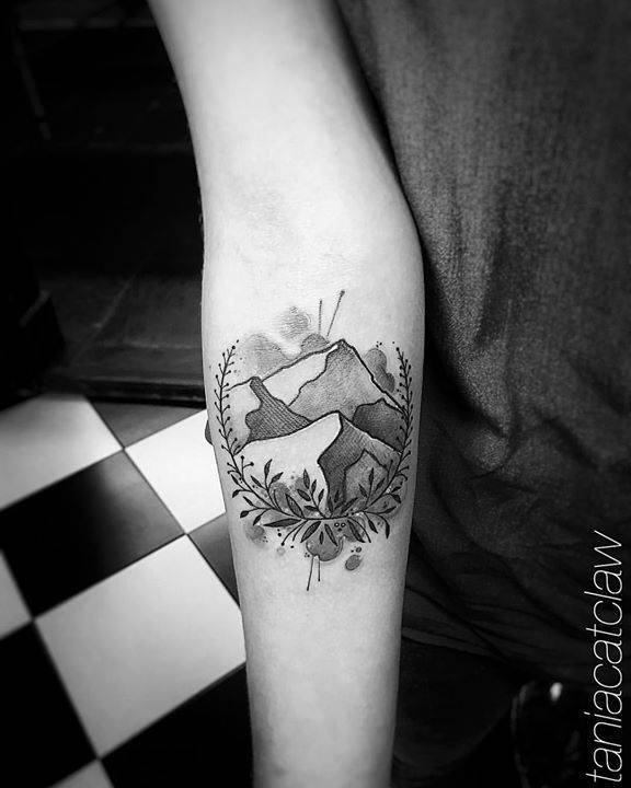 Mountain and flowers tattoo