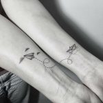 Paper boat and plane tattoo