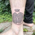 Pomegranate half tattoo