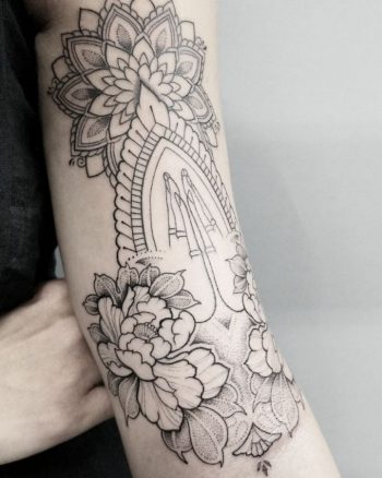 Praying hands and mandala tattoo