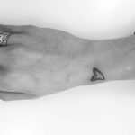 Shark fin tattoo by Cody Simpson